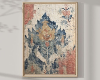 May include: A rectangular wall art print in a light wood frame featuring a distressed, textured pattern with a large central blue and gold floral motif, accented by faded red sections and muted cream tones, presented in a vertical orientation.