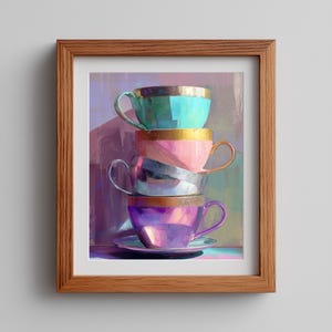 May include: A framed art print showing four stacked teacups in vibrant colours. The cups are teal, pink, silver, and purple, each with a gold rim. The artwork has a soft, painterly style, with a focus on colour and light.