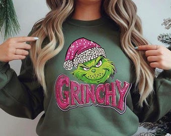 Sudadera navideña Grinchy: diseño rosa con bordado falso