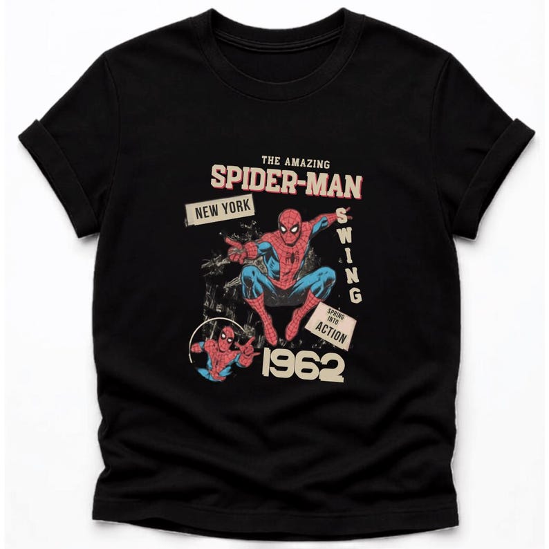 May include: Black t-shirt with a retro Spider-Man design. The graphic includes the words "THE AMAZING SPIDER-MAN" and "NEW YORK". The superhero is shown in action, with the year "1962" featured prominently.
