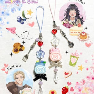 May include: Two decorative phone charms with pastel-colored beads, charms, and miniature dessert-themed pendants. One charm has a blue cord, the other a pink cord. The charms include the text "Kaoru Hana wa Rin to Saku", and character illustrations.
