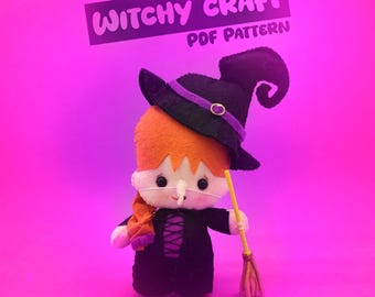 May include: A felt witch doll with orange hair, a black hat with a purple band, and a black dress. The doll holds a yellow broom. The text "Witchy Craft PDF Pattern" is above the doll against a pink background.