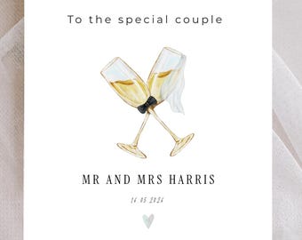 Tarjeta de boda personalizada con ilustración de copas de champán, estilo minimalista moderno, fabricada en el Reino Unido.