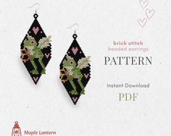May include: Black beaded earrings with a diamond shape, featuring a green frog design with wings and pink hearts. The text on the image says "brick stitch beaded earrings PATTERN Instant Download PDF". The earrings are from Maple Lantern Pattern.