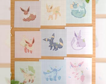 May include: A collection of nine square art prints featuring various stylized creatures with soft pastel color palettes and grid backgrounds. Each print displays a different character with small leaf accents. The text by mossyleaf studio is visible.