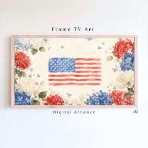May include: Watercolor artwork of the American flag, framed with a light wood border. The flag is surrounded by red, white, and blue hydrangeas. The text "Frame TV Art" and "Digital Artwork" are displayed on the image.