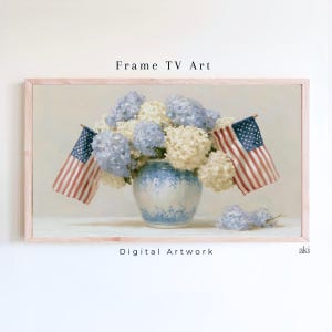 May include: A framed digital artwork featuring a floral arrangement of blue and white hydrangeas in a blue and white vase, with two American flags. The artwork is labeled "Frame TV Art" and "Digital Artwork".
