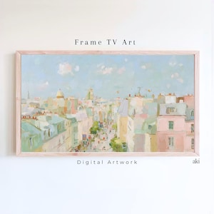 May include: A framed digital artwork depicting a cityscape with pastel colors. The painting features buildings in shades of pink, green, and yellow under a light blue sky. The artwork is labeled "Frame TV Art" and "Digital Artwork".