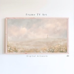 May include: A framed digital artwork with a serene landscape. The artwork features a soft, pastel color palette with a cross on the horizon. The text "Frame TV Art" and "Digital Artwork" are visible. The frame is a light wood color.