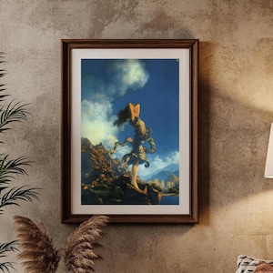 May include: A framed artwork depicting a classical figure standing on a rocky landscape, set against a blue sky with clouds. The artwork is in a dark wooden frame, displayed in a living room setting with a sofa, pillows, and a floor lamp.