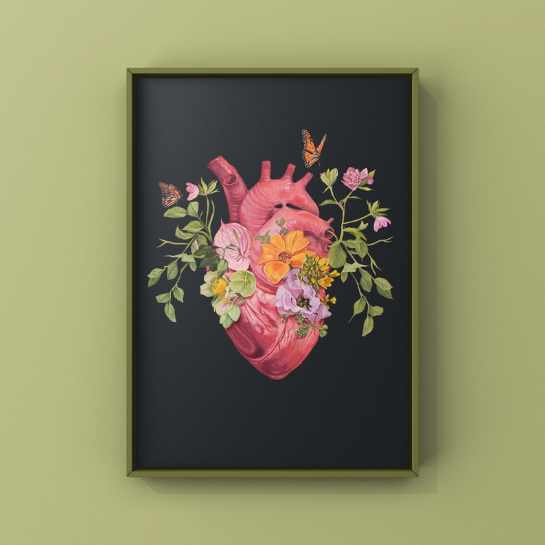 May include: A framed print of a human heart with flowers and butterflies. The heart is pink and red, the flowers are pink, yellow, and white, and the butterflies are orange and black.