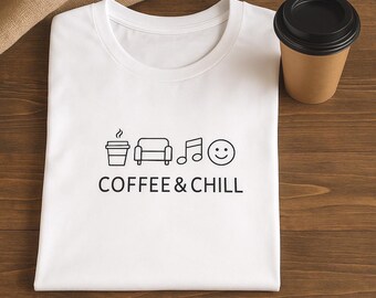 May include: A white crew neck t-shirt featuring a black graphic print of a coffee cup, a sofa, a musical note, and a smiley face icon, with the text COFFEE & CHILL printed in a clean, sans-serif font centered below the icons.