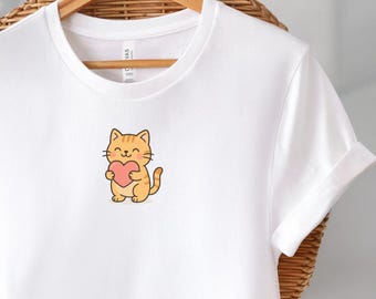 Camiseta con un lindo gato sosteniendo un corazón - Camiseta de gatito kawaii - Camiseta con estampado de animales adorables - Regalo de San Valentín - Camiseta con estética pastel para amantes de los gatos