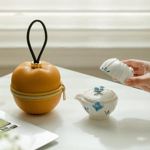 Handgeschilderde orchidee keramische reistheeset, draagbaar theeservies