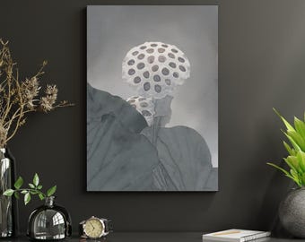 May include: A framed canvas print depicting a watercolour illustration of a lotus pod with a textured, dotted surface. The artwork is mainly grey and white, with soft shading and a botanical theme. The print is displayed on a dark grey wall.