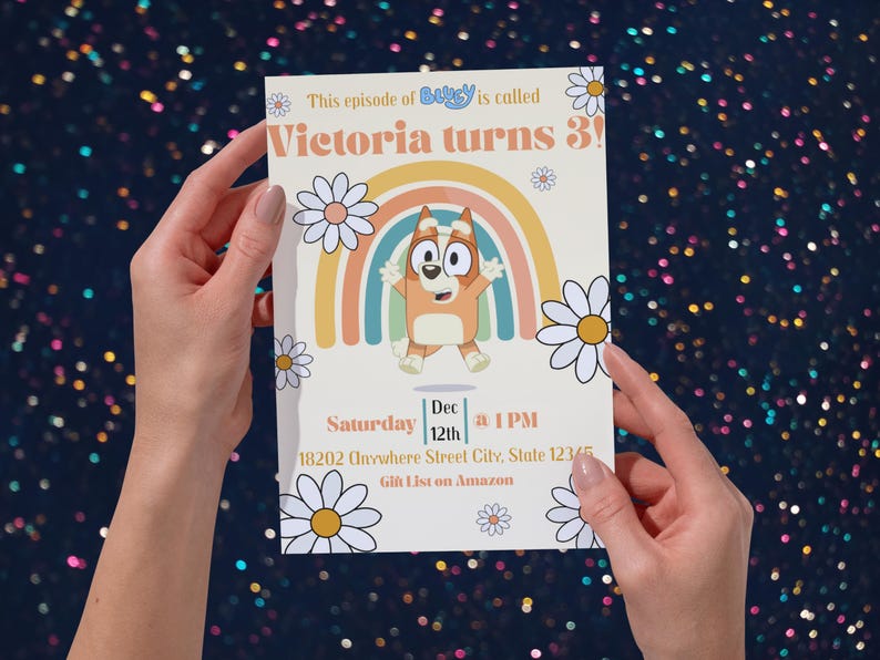 May include: A birthday invitation featuring a cartoon character and a rainbow design. The text reads "Victoria turns 3!" with event details. Daisies surround the design, with the words "This episode of Bluey is called" at the top.