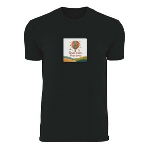 May include: Black t-shirt featuring a colorful graphic of a hot air balloon with butterflies and the text "Dejate sentir lo que sientes". The graphic is set against a landscape of fields and hills.