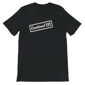 May include: Black t-shirt with the text "Emotional FIT" in a white rectangular box. The text is in a sans-serif font. The t-shirt is short-sleeved and made of a soft material.