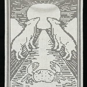 May include: White crocheted wall hanging featuring a detailed design of two wolves howling at a full moon. The image is framed with a border and the words "THE MOON" are at the bottom. The piece is made of white yarn and has a black background.