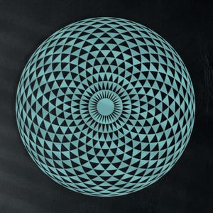 May include: A large, round wall art piece with a geometric pattern of teal triangles against a black background. The artwork is the focal point of a living room setting, complemented by teal pillows and decorative vases.