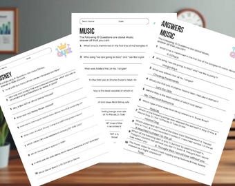 May include: Three white sheets of paper with quiz questions on Disney and Music, and answers to the music quiz. The papers are on a wooden surface with a framed picture and a clock in the background.