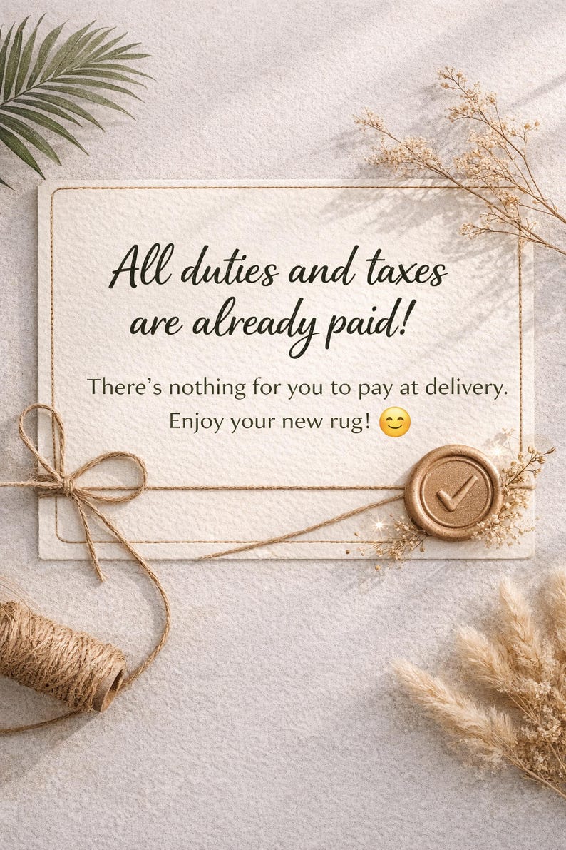 May include: A cream-colored card with the text "All duties and taxes are already paid!" and "There's nothing for you to pay at delivery. Enjoy your new rug!" A twine bow and a wax seal with a checkmark are also visible.