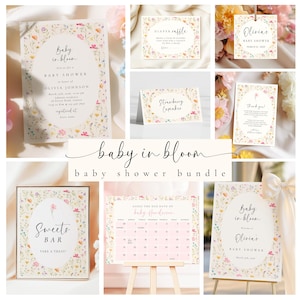 May include: A collection of baby shower stationery with floral designs. Includes invitations, a diaper raffle card, a tag, a thank you card, a sweets bar sign, and a calendar. The text "Baby in Bloom" is featured prominently.