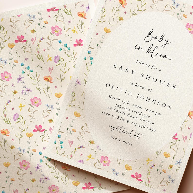 May include: Baby shower invitation with a floral design. The invitation features the text "Baby in bloom" and details for Olivia Johnson's baby shower, including the date, time, and location. The invitation is decorated with colorful watercolor flowers.