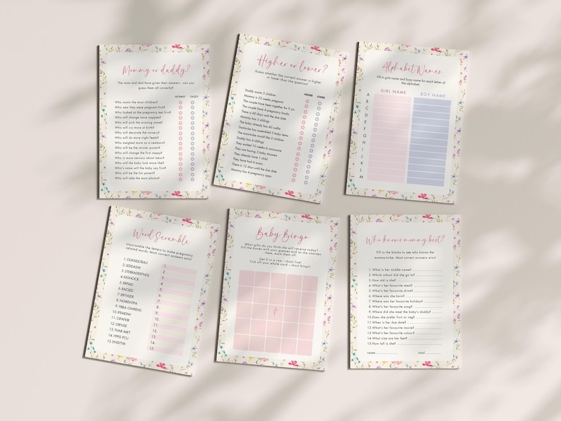 May include: Six baby shower game cards with floral borders. Games include "Mommy or Daddy?", "Higher or Lower?", "Alphabet Women", "Word Scramble", "Baby Bingo", and "Who knows me best?" The cards have pink and blue accents.