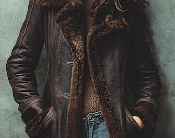 May include: A dark brown leather jacket featuring a thick, plush faux fur lining that extends along the wide lapels and cuffs. The jacket has a weathered texture, long sleeves, and two front pockets, worn over a brown turtleneck jumper.