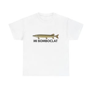 May include: White t-shirt featuring a detailed illustration of a fish in shades of green and brown. Below the fish, the text reads "MI BOMBOCLAT" in black capital letters. The shirt is made of a soft, comfortable material.