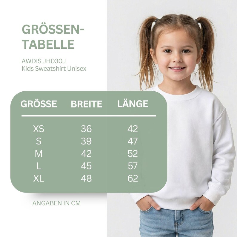May include: A size chart for an AWDIS JH030J kids sweatshirt with columns for size, width, and length in centimeters. The chart lists sizes XS through XL with corresponding measurements. A child wears a plain white crewneck sweatshirt.
