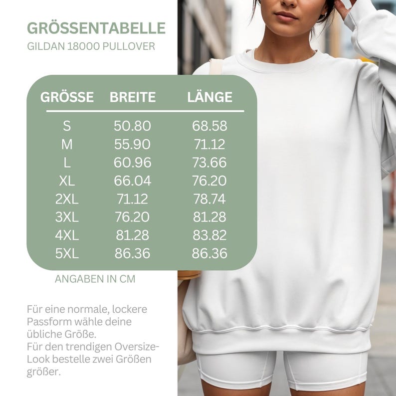 May include: A white Gildan 18000 pullover sweatshirt paired with white shorts. A green chart displays a size guide with columns for size, width, and length in centimeters, ranging from S to 5XL, with measurements from 50.80 to 86.36.