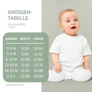 May include: A size chart for a Babybugz BZ02 t-shirt with columns for size, width, and length in centimeters. The chart lists sizes from 0-3 M to 2-3 J. Next to the chart is a baby wearing a plain white short-sleeved t-shirt.
