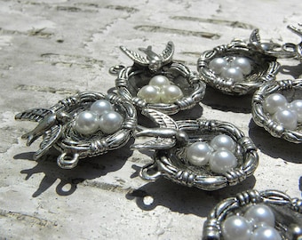 Silver bird nest charm