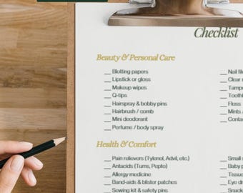 May include: A clipboard with a checklist titled "emergency kit checklist." The checklist includes categories like Beauty & Personal Care, Health & Comfort, Wardrobe & Accessories, and Miscellaneous. A hand holds a pencil near the checklist.