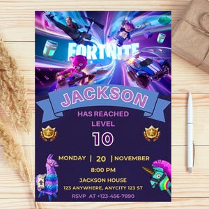 May include: A Fortnite-themed invitation with a purple and blue color scheme. The invitation features the name "Jackson", the text "Has Reached Level 10", and event details. The design includes game characters and logos.