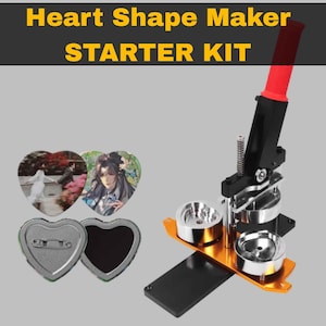 May include: A heart shape maker starter kit with a black and orange base, a red handle, and silver moulds. The kit includes heart-shaped button components and examples with printed images. The text "Heart Shape Maker STARTER KIT" is displayed.