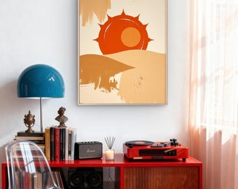 Könnte beinhalten: Gerahmter Kunstdruck mit einem abstrakten Motiv einer orangefarbenen Sonne über einer Wüstenlandschaft. Das Kunstwerk hängt über einem roten Schrank mit Plattenspieler, Lautsprechern und einer blauen Lampe. Davor steht ein durchsichtiger Plastikstuhl.