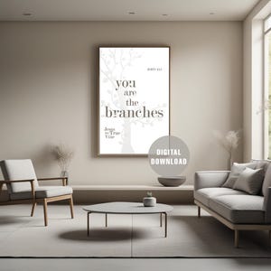 May include: A framed print with the text "You are the branches" and "Jesus the True Vine" in a modern living room setting. The print is a digital download. The room features a sofa, chair, and coffee table.