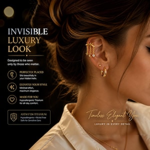 May include: A gold-toned ear cuff featuring three delicate dangling chains with small charms, including a clear stone, worn on the helix. Below, a simple gold-toned hoop earring is worn in the earlobe. The image includes text: INVISIBLE LUXURY LOOK.