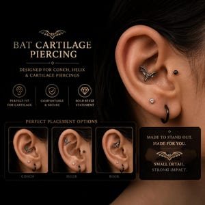 May include: A silver-toned bat-shaped cartilage piercing jewelry piece shown in a conch, helix, and rook placement. The image includes text reading BAT CARTILAGE PIERCING, DESIGNED FOR CONCH, HELIX & CARTILAGE PIERCINGS, and MADE TO STAND OUT.