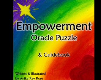 Op de afbeelding: Vierkante afbeelding met de tekst "Empowerment Oracle Puzzle & Guidebook" tegen een regenboogachtergrond. Een gele ster en een rood hart zijn ook zichtbaar. De tekst "Written & Illustrated by Anika Ray Rose" staat onderaan.