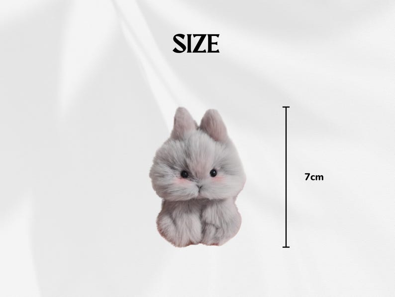 May include: A plush, gray bunny figurine with pink cheeks and small black eyes. The bunny is 7 cm tall. The word "SIZE" is above the bunny.