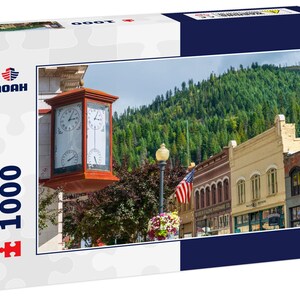 Noah Jigsaw Puzzle An antique clock showing time and temperature on the corner of a vintage building in the historic mining town of Wallace,