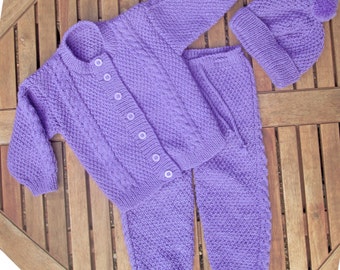 Baby infant girl toddler hand knitted mauve traditional matinee outfit of jacket / cardigan trousers / legging pants pom pom hat pram set.