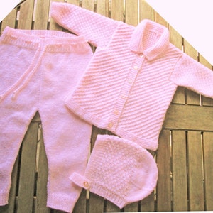 Baby infant girl hand knitted pale pink matinee outfit of jacket / cardigan trousers / leggings bonnet / hat pram set.