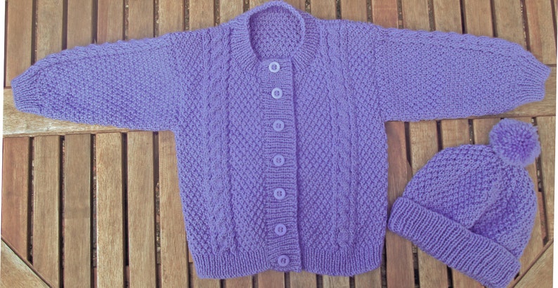 Baby infant girl toddler hand knitted mauve traditional matinee outfit of jacket / cardigan trousers / legging pants pom pom hat pram set. image 2