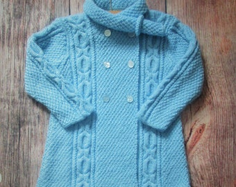 Little toddler girl's hand knitted traditional cable button coat, jacket, aran cardigan, sweater with scarf in pale blue
