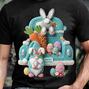 以下が含まれることがあります： イースターをテーマにしたデザインの黒いTシャツ。水色のトラックには、ニンジン、イースターエッグ、ウサギが積まれています。卵を持ったノームもいます。「HAPPY EASTER」の文字がトラックにプリントされています。